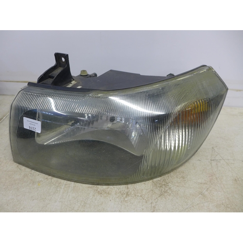 2374 - A pair of headlights for a Ford Transit van