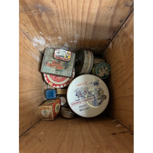 381 - A tea crate containing a collection of tobacco tins