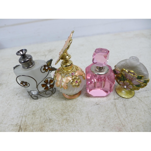 2134 - Two bags of costume jewelry and and 5 collectible perfume bottles