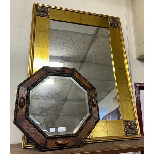 387 - An oak octagonal framed mirror and a gilt framed mirror