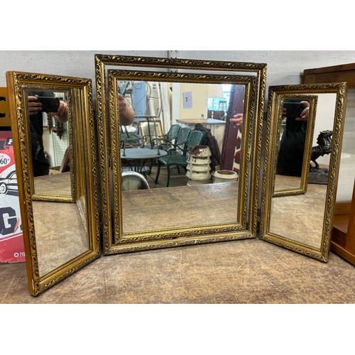 387A - A gilt framed triptych dressing table mirror