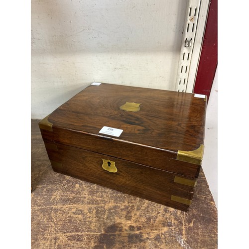 395 - A Victorian rosewood and brass mounted writing slope