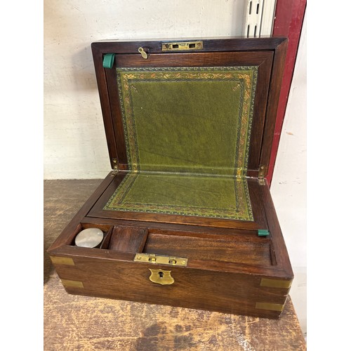 395 - A Victorian rosewood and brass mounted writing slope