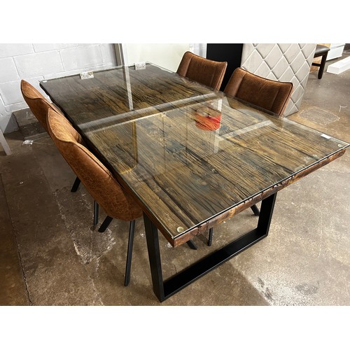 1430 - A railway sleeper dining table and four chairs *This lot is subject to VAT