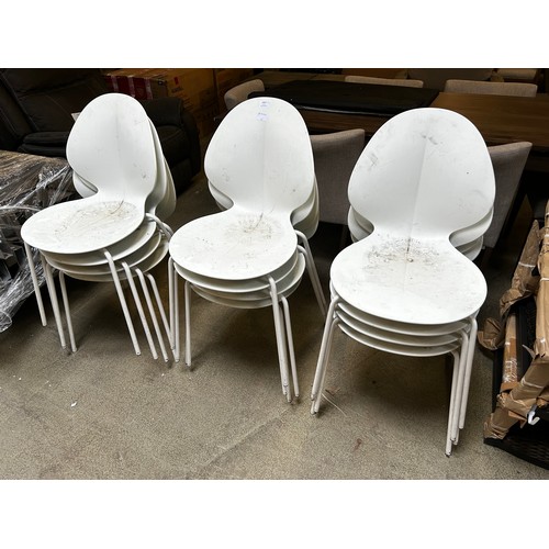 1457 - A set of twelve white plastic stacking chairs