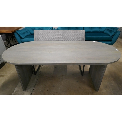 1302 - A grey oval dining table and two Apollo grey high back benches  *This lot is subject to VAT