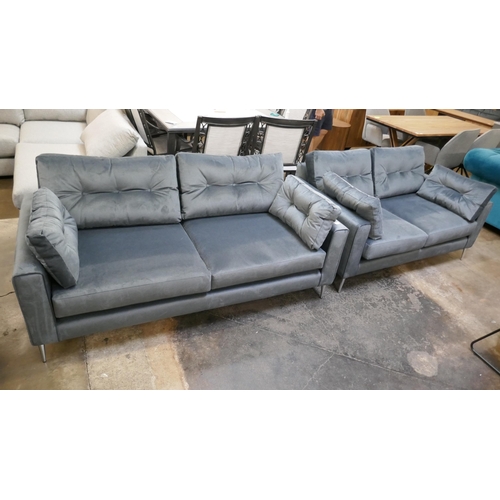 1303 - A slate velvet upholstered three seater sofa and two seater sofa on stiletto legs