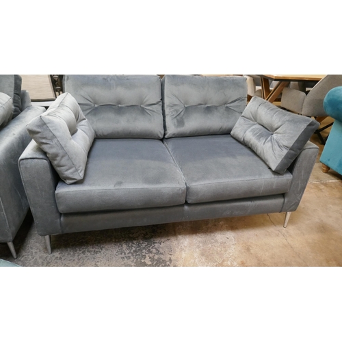 1303 - A slate velvet upholstered three seater sofa and two seater sofa on stiletto legs