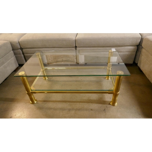 1355 - A brass coffee table with glass shelf