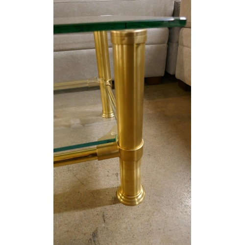 1355 - A brass coffee table with glass shelf