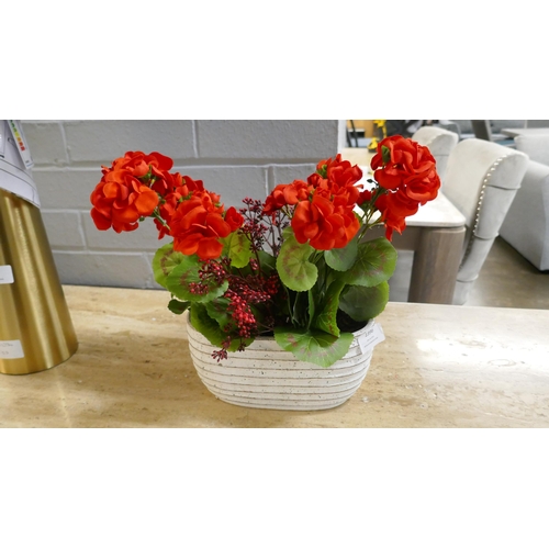 1396 - An oval pot with a display of faux Geraniums, H 30cms (54963209)   *This lot is subject to vat