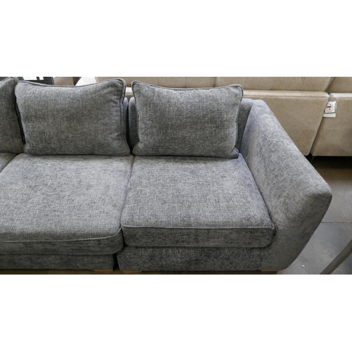 1421 - A storm grey textured weave upholstered corner sofa on oak feet