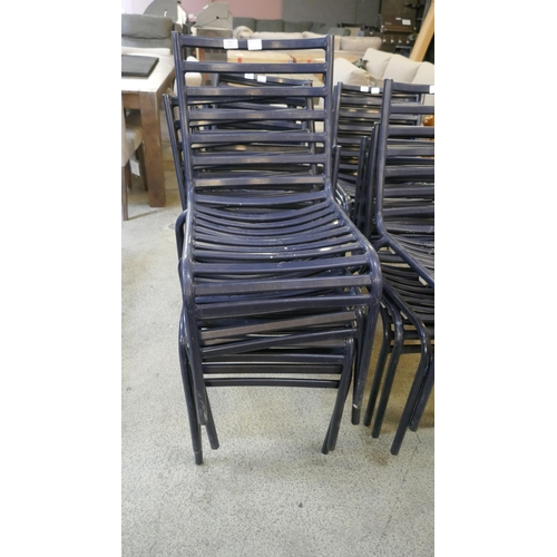 1504 - A set of four navy blue painted, stacking, metal garden chairs