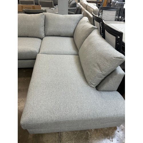 1400 - A grey textured weave upholstered corner sofa