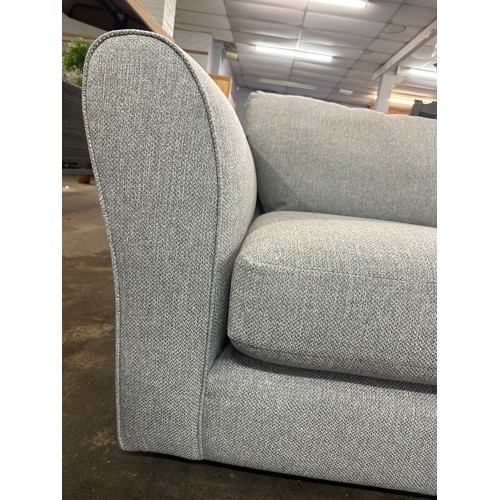 1400 - A grey textured weave upholstered corner sofa