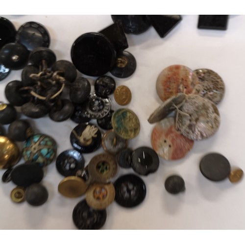 914 - A collection of Victorian and later buttons, mainly jet and black glass