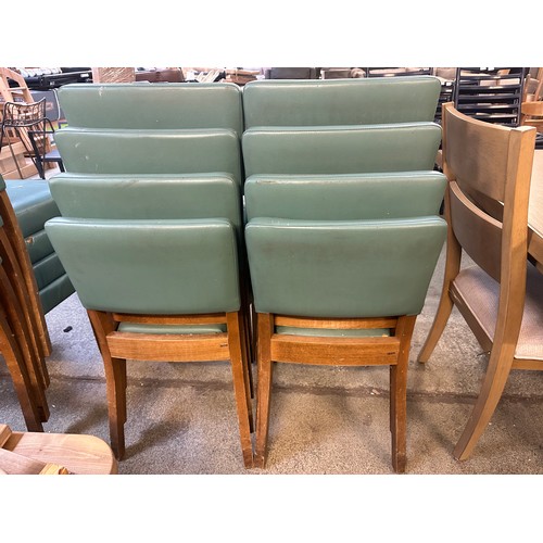 1484 - A set of eight green faux leather upholstered dining chairs, various conditions