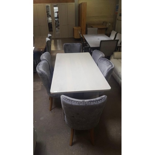 1411 - Light grey wooden dining table and six grey upholstered chairs *This lot is subject to VAT