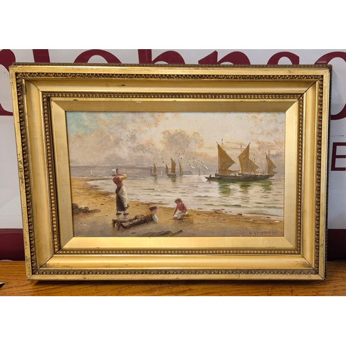 31 - W. Richards, beach scene with children looking out to boats, oil on canvas, signed lower right, 29 x... 