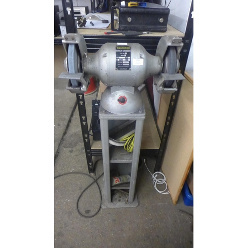 2039 - A Stanley type BG 8 model A double ended 230V single phase bench grinder mounted to steel work platf... 