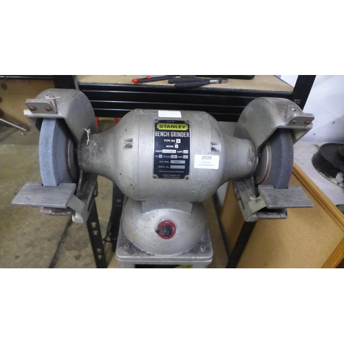 2039 - A Stanley type BG 8 model A double ended 230V single phase bench grinder mounted to steel work platf... 