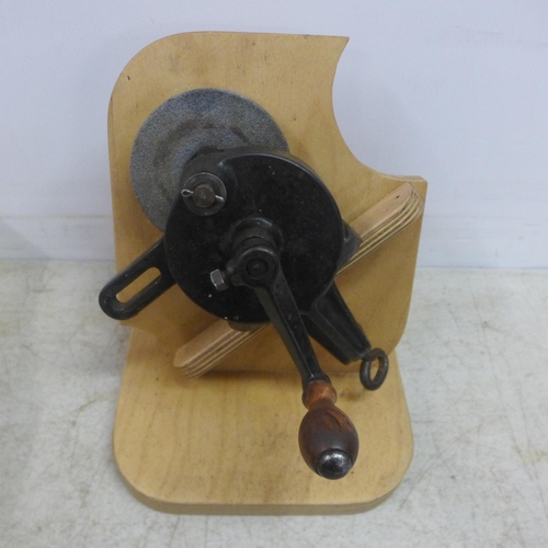 2046 - 2 vintage hand drills and a vintage grinder, all mounted