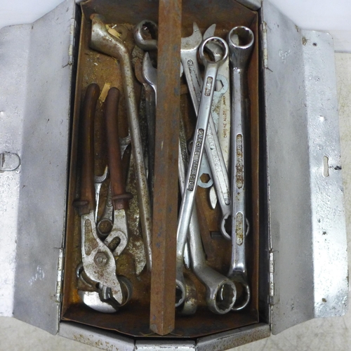 2064 - A metal tool box of tools including mainly assorted spanners