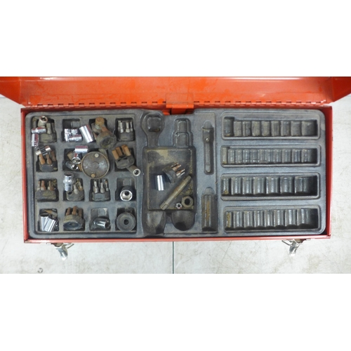 2036 - A red metal tool box with two drawers including sockets, screwdriver heads, wrenches, etc. 2 empty w... 