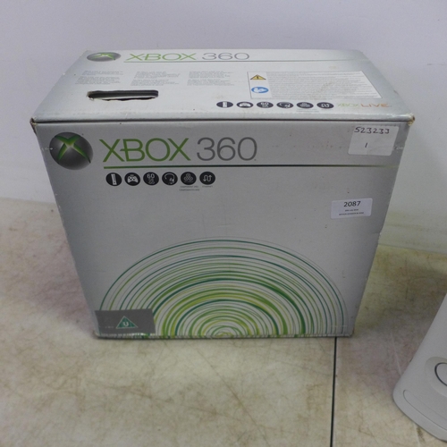 2087 - A boxed Microsoft XBox 360 gaming console with 600GB HDD, an Xbox 360 wireless controller, HDMI cabl... 