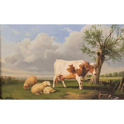 67 - A 19th Century style landscape with a cow and sheep in a field, oil on board, 16 x 26cms, framed