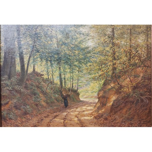 75 - Albert Caullet (Flemish 1875-1950), figure on a woodland path, oil on canvas, signed lower right, 68... 