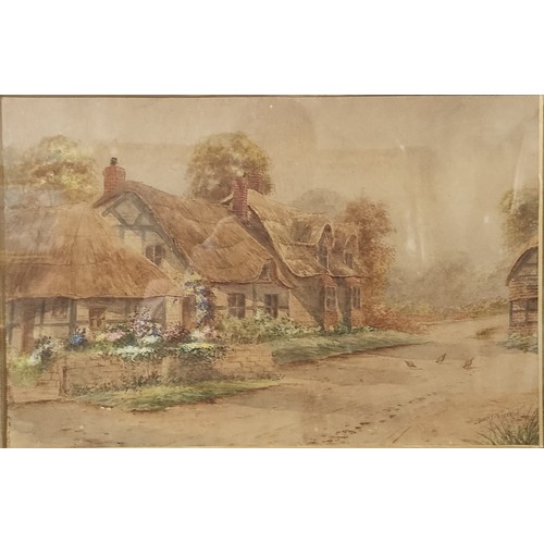 80 - Ernest Potter, thatched cottages in a village, signed lower right, 29 x 44cms, framed