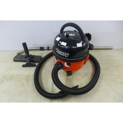 2121 - A Henry Numatic vacuum cleaner with multiple cleaning attachments