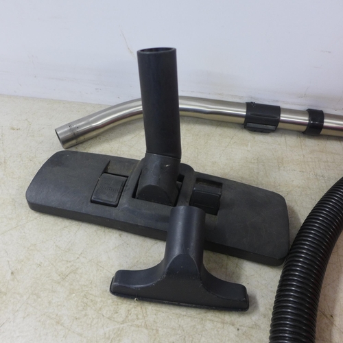 2121 - A Henry Numatic vacuum cleaner with multiple cleaning attachments