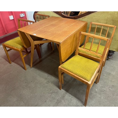 243 - A G-Plan Brandon oak drop leaf dining table and four chairs