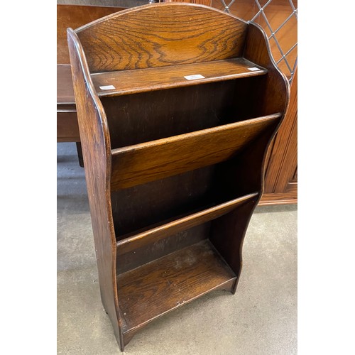 295 - A small early 20th Century oak newspaper rack