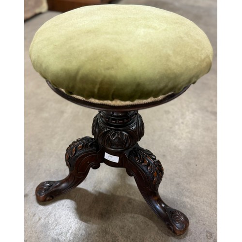 280 - A Victorian carved mahogany and fabric upholstered piano stool