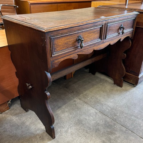 299 - A Victorian Gothic Revival two drawer oak desk