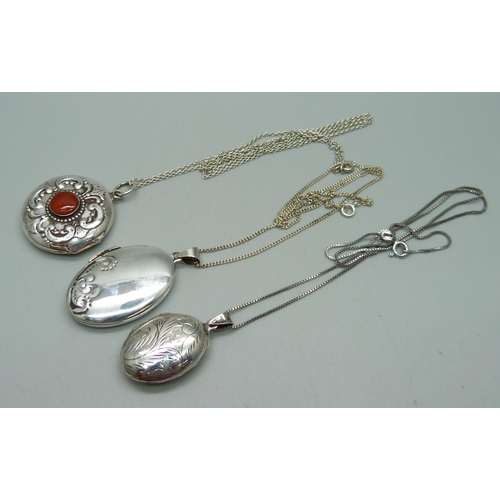 1013 - Three silver lockets and chains