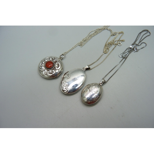 1013 - Three silver lockets and chains