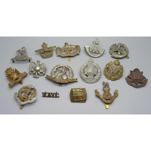 1028 - A collection of military regimental badges, 15 in total