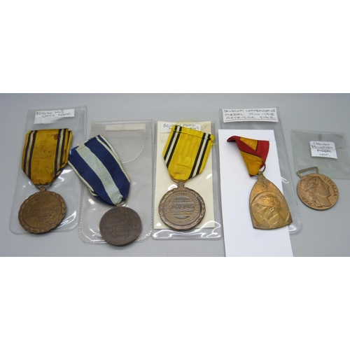 1031 - Three Belgian medals; 1914-1918 and two WWII including Peace Medal, a Greek 1940-41 medal and an Ita... 