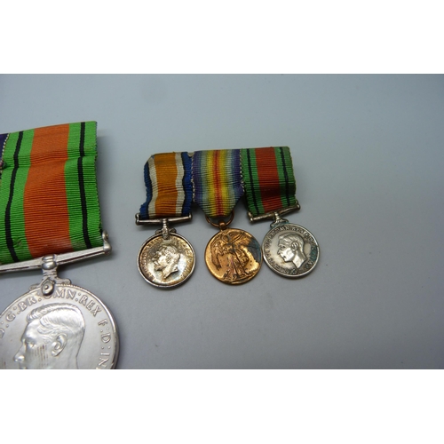 1035 - A pair of WWI medals to 2085 W.O. CL. II R.R. Rich 15-London Regiment, a WWII medal and miniatures