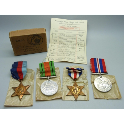 1036 - Four WWII medals all in original postage box certificate addressed to C.E. Almond, Twickenham, Middl... 