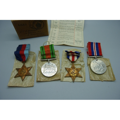 1036 - Four WWII medals all in original postage box certificate addressed to C.E. Almond, Twickenham, Middl... 