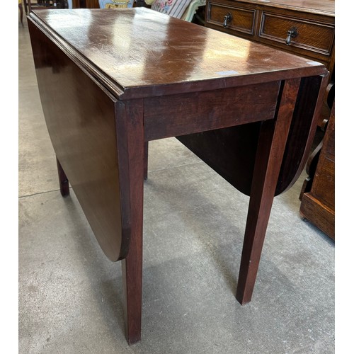 303 - A George III mahogany drop leaf table