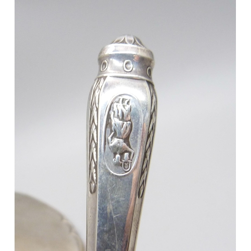 1072 - A silver backed hand mirror, a letter opener and a button hook