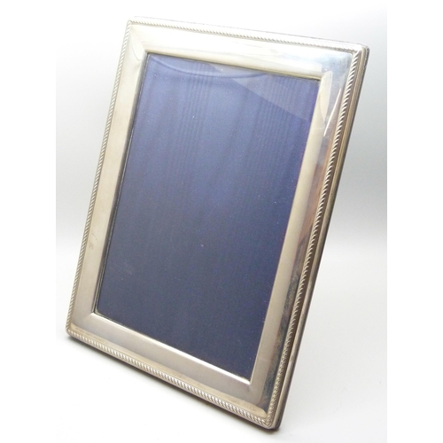 1073 - A silver photograph frame, Carr's of Sheffield, 17cm x 22cm