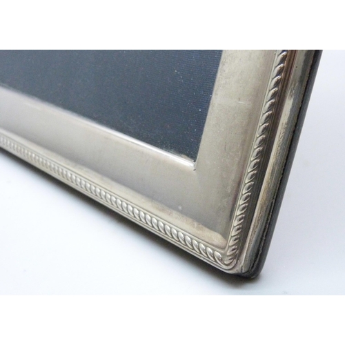 1073 - A silver photograph frame, Carr's of Sheffield, 17cm x 22cm