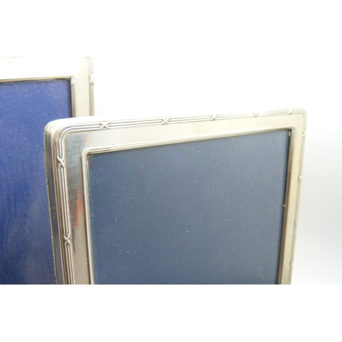 1075 - Three silver photograph frames, heights 15.5cm, 20.5cm and 21cm